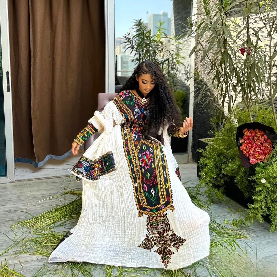 Majestic Embroidery Designed Habesha Dress: with Multicolored Stitches Traditional Ethiopian Dress